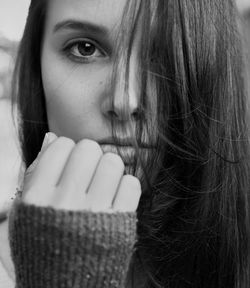 Close-up portrait of confident young woman