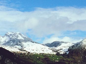 Scenic view of snowcapped mountains against sky