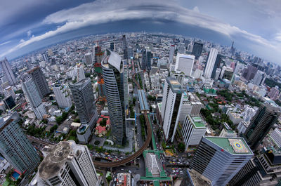 High angle view of modern buildings in city against sky