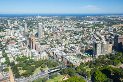 High angle view of modern buildings in city against sky