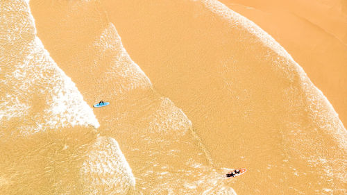 High angle view of man surfing on beach