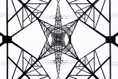 From below black and white close up of energy tower creating abstract background geometric shapes