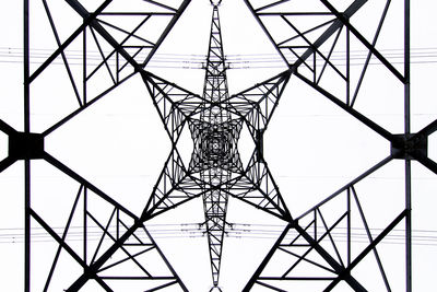 From below black and white close up of energy tower creating abstract background geometric shapes