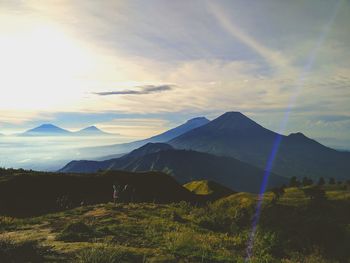 Scenic view of mountains against sky during sunset