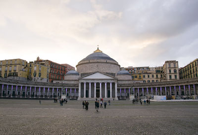 Group of people in front of buildings in city
