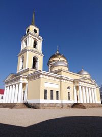 Low angle view of building against blue sky