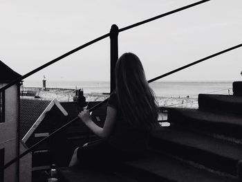 Rear view of woman looking at sea