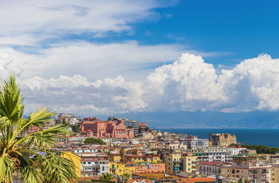 Panoramic view of townscape by sea against sky