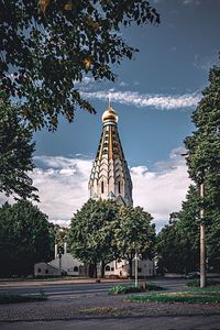 Low angle view of golden gate against sky