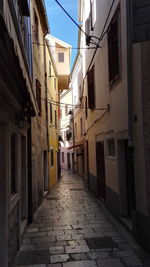 Narrow alley along houses