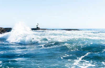 Scenic view of sea against clear sky