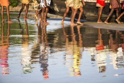 Low section of men on water