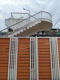 Low angle view of spiral staircase in building against sky