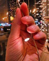 Close-up of hand holding sparkler