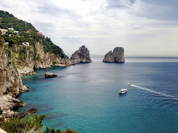 Capri, italy. view to faraglioni rocks from via krupp. turquoise blue water.