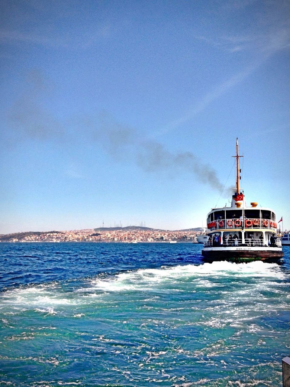 water, sea, blue, waterfront, sky, built structure, scenics, nature, architecture, tranquil scene, beauty in nature, tranquility, building exterior, lighthouse, cloud - sky, day, nautical vessel, horizon over water, rippled, outdoors