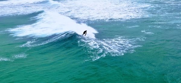 High angle view of man surfing in sea