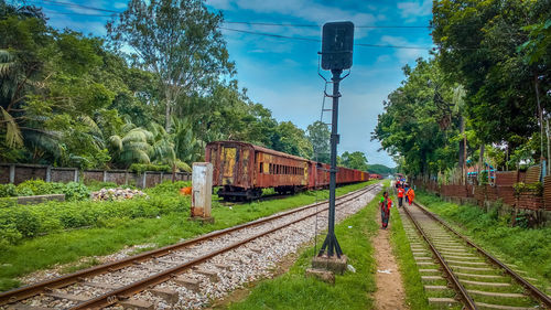 Train on railroad track against sky