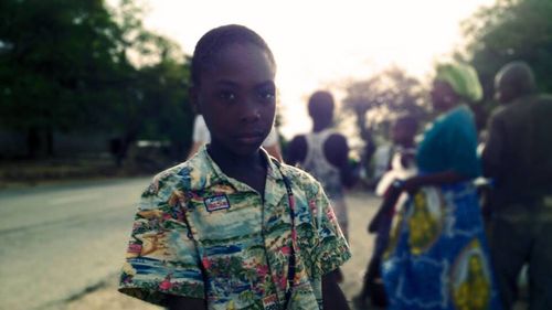 Portrait of teenage girl standing outdoors