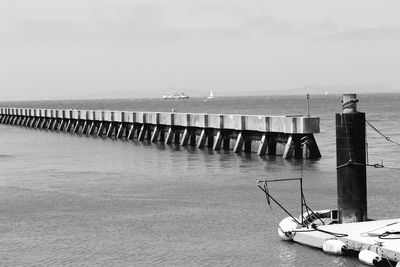 Pier over sea against sky