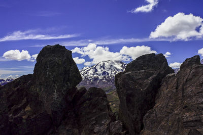 Scenic view of mountains against sky during winter