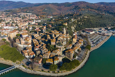 Aerial view of passignano sul trasimeno, a small town along the lake near perugia,