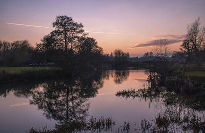 A winter sunset over the river stour in dedham in essex, uk
