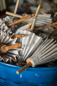 High angle view of wicker basket on wood