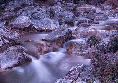 River flowing through rocks in forest