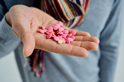 Close-up of woman hand holding flowers