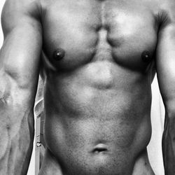 Midsection of shirtless man