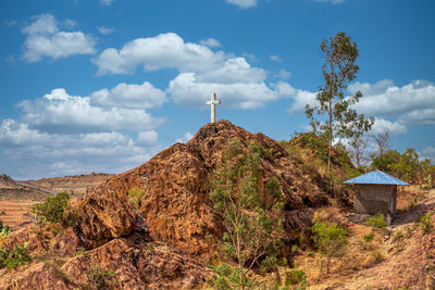 Scenic view of land and mountains against sky