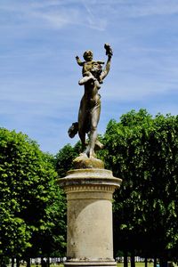 Low angle view of statue against sky