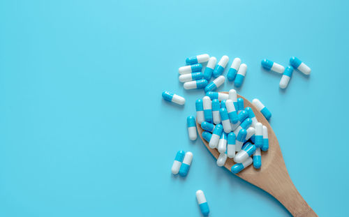 Directly above shot of pills on blue background