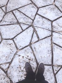 Low section of man standing on floor