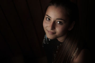 Close-up portrait of a smiling young woman