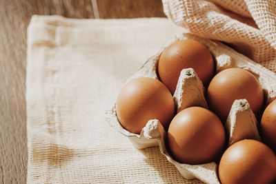 High angle view of eggs in basket on table