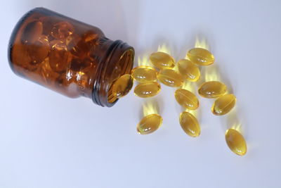 Close-up of wineglass against white background