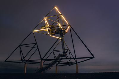 Low angle view of illuminated built structure at night