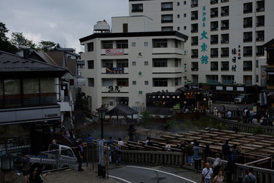 High angle view of buildings by street in city