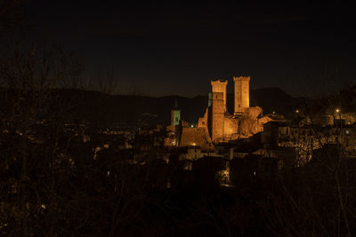 Illuminated buildings in city at night