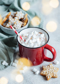 Cozy winter and christmas setting with hot cocoa and homemade cookies