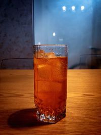 Close-up of glass of ice on table