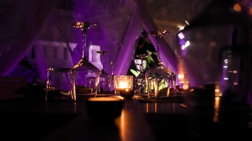 Lit candle on table at restaurant