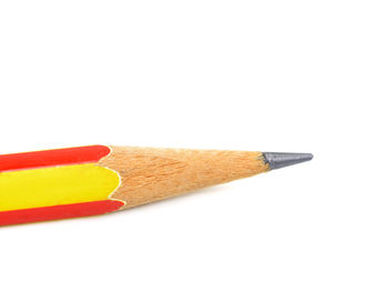 Close-up of colored pencils against white background