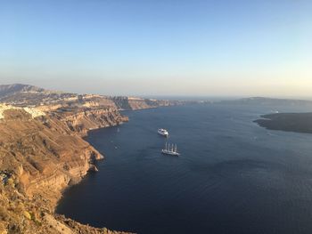 High angle view of boats sailing in sea against clear sky