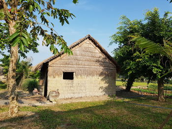 House on field against sky