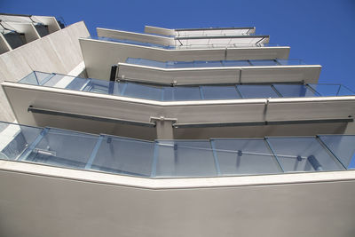 Low angle view of building against clear blue sky