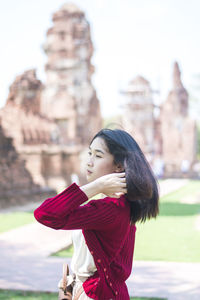 Young woman standing in temple