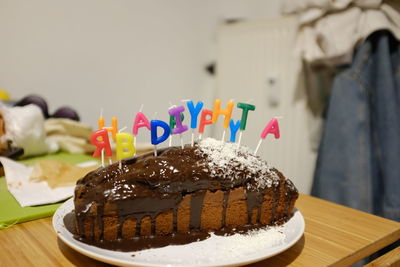 Close-up of cake with text on table